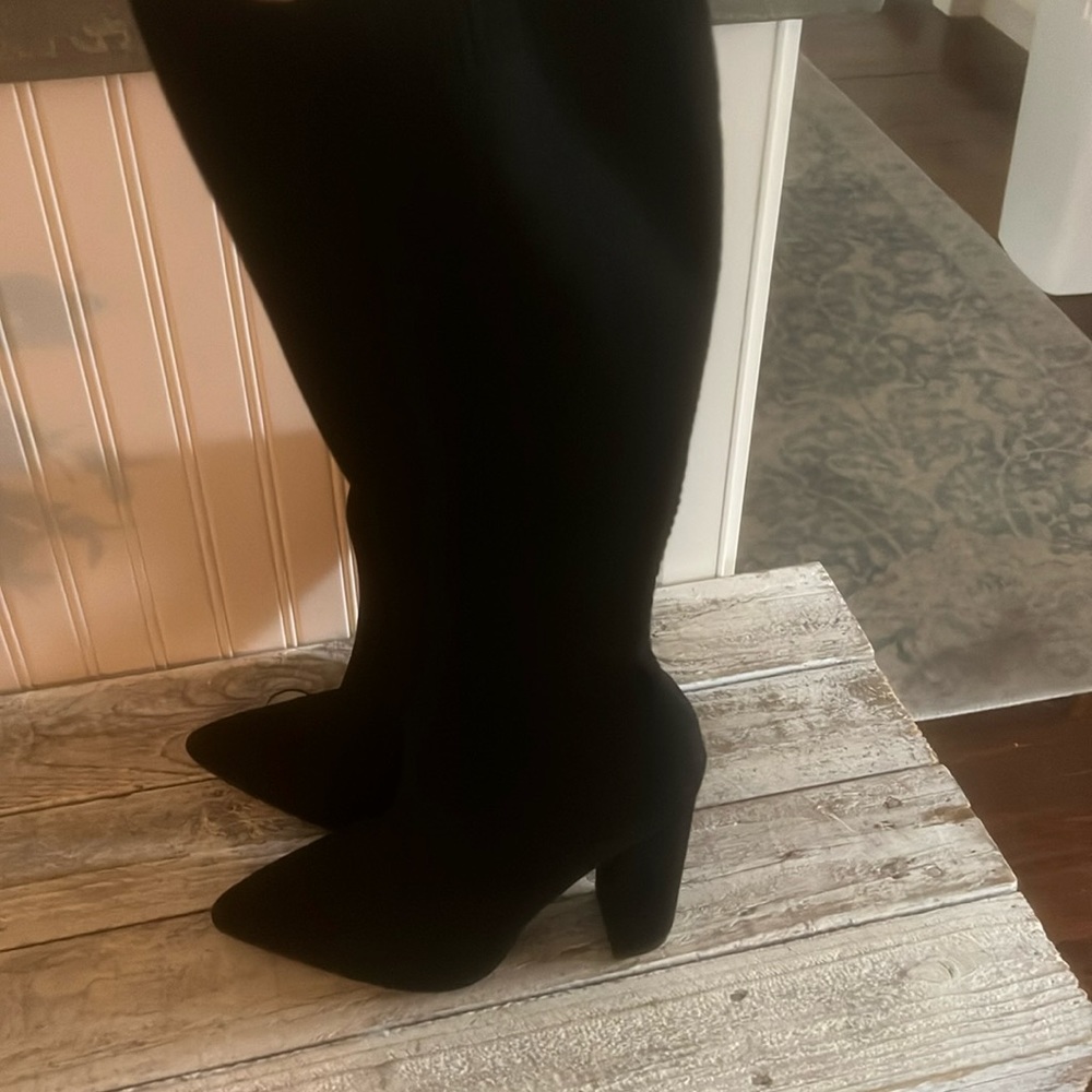Never worn pull up stretch heeled boots
